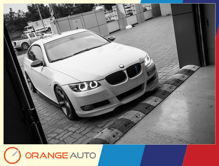 White BMW parked in a garage