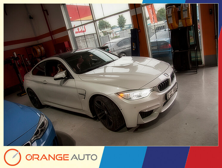White BMW in a garage